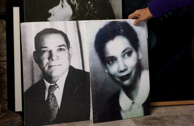 Retired judge Maryellen Hicks shows photographs of her ancestors on Monday, Feb. 23, 2026. Throughout her career, Hicks achieved numerous milestones, including serving as the first and only African American woman to hold the position of state district judge in Fort Worth.
